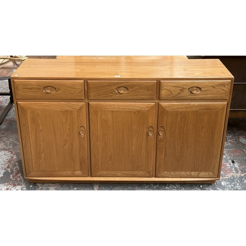 145 - An Ercol Windsor blonde elm and ash sideboard - approx. 93cm high x 156cm wide x 43cm deep