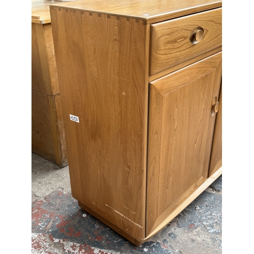 145 - An Ercol Windsor blonde elm and ash sideboard - approx. 93cm high x 156cm wide x 43cm deep