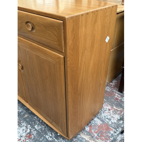 145 - An Ercol Windsor blonde elm and ash sideboard - approx. 93cm high x 156cm wide x 43cm deep