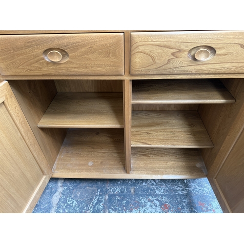 145 - An Ercol Windsor blonde elm and ash sideboard - approx. 93cm high x 156cm wide x 43cm deep