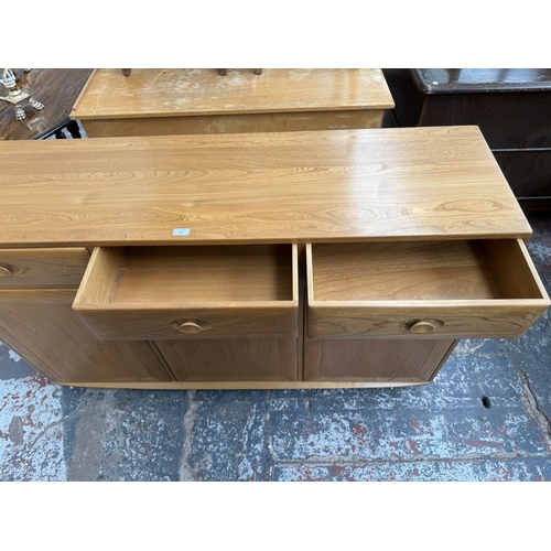 145 - An Ercol Windsor blonde elm and ash sideboard - approx. 93cm high x 156cm wide x 43cm deep