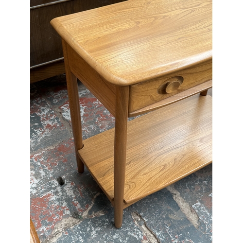 146 - An Ercol Windsor blonde elm and ash console table - approx. 72cm high x 79cm wide x 41cm deep