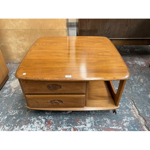 147 - An Ercol stained elm Pandora coffee table - approx. 40cm high x 78cm wide x 79cm deep