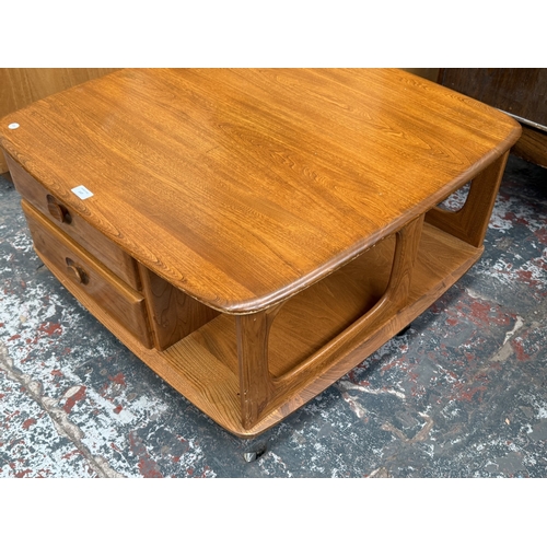 147 - An Ercol stained elm Pandora coffee table - approx. 40cm high x 78cm wide x 79cm deep