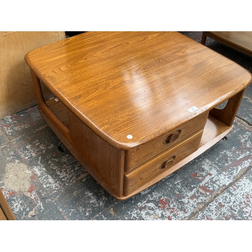 147 - An Ercol stained elm Pandora coffee table - approx. 40cm high x 78cm wide x 79cm deep