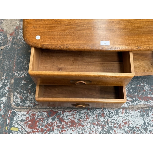 147 - An Ercol stained elm Pandora coffee table - approx. 40cm high x 78cm wide x 79cm deep