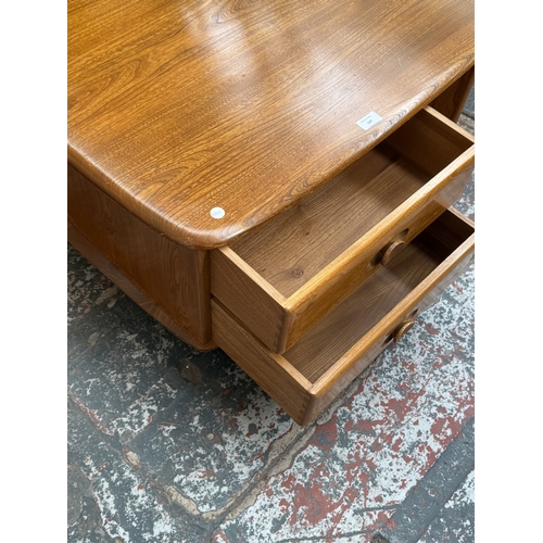 147 - An Ercol stained elm Pandora coffee table - approx. 40cm high x 78cm wide x 79cm deep