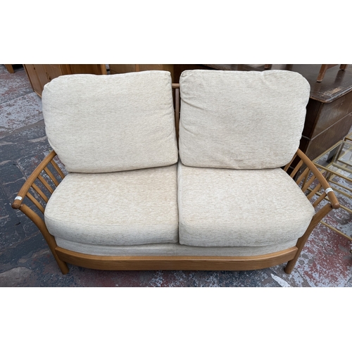 148 - An early Renaissance ash two-seater sofa with beige fabric cushioned cushions - approx. 93cm high x ... 