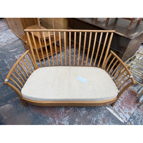 148 - An early Renaissance ash two-seater sofa with beige fabric cushioned cushions - approx. 93cm high x ... 