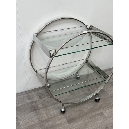 150 - An Art Deco style chrome plated and glass circular two-tier drinks trolley - approx. 80cm high x 74c... 