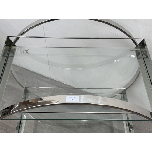 150 - An Art Deco style chrome plated and glass circular two-tier drinks trolley - approx. 80cm high x 74c... 