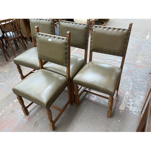 152 - Four Cromwellian style carved oak and tan vinyl upholstered dining chairs