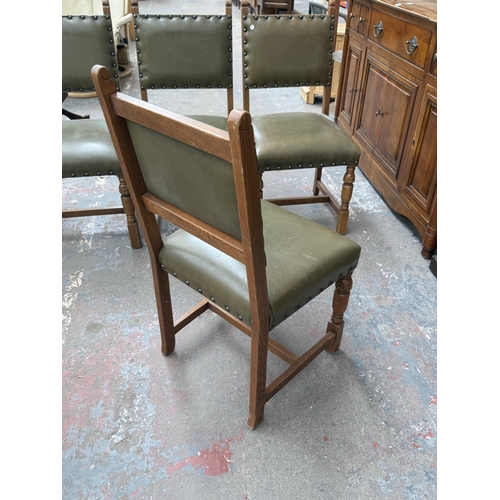 152 - Four Cromwellian style carved oak and tan vinyl upholstered dining chairs