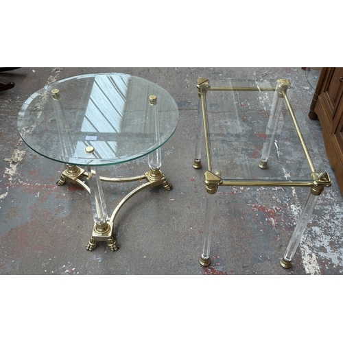 155 - Two Hollywood Regency style glass, brass and lucite side tables, one circular - approx. 50cm high x ... 