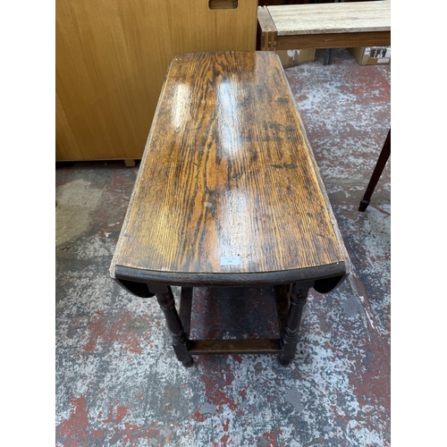 156 - An early 20th century oak drop-leaf gate-leg dining table - approx. 72cm high x 120cm wide x 150cm l... 