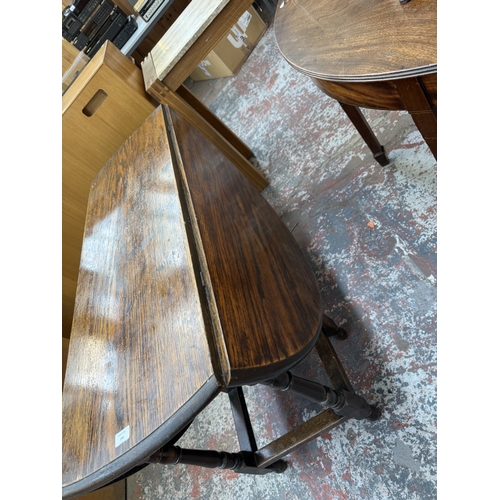 156 - An early 20th century oak drop-leaf gate-leg dining table - approx. 72cm high x 120cm wide x 150cm l... 