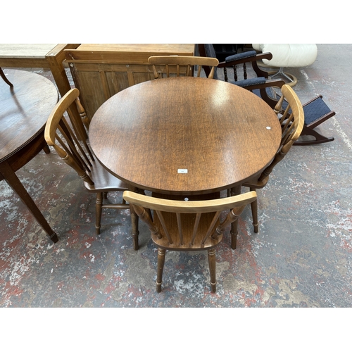 159 - A late 20th century oak and beech circular dining table - approx. 73cm high x 91cm diameter