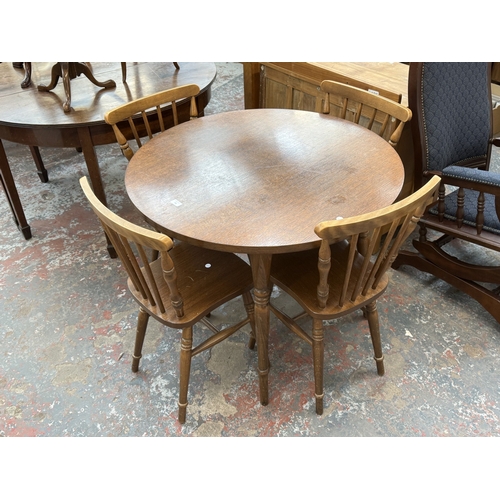 159 - A late 20th century oak and beech circular dining table - approx. 73cm high x 91cm diameter