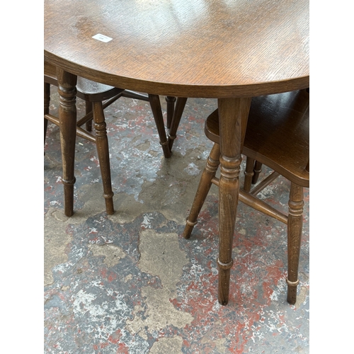 159 - A late 20th century oak and beech circular dining table - approx. 73cm high x 91cm diameter