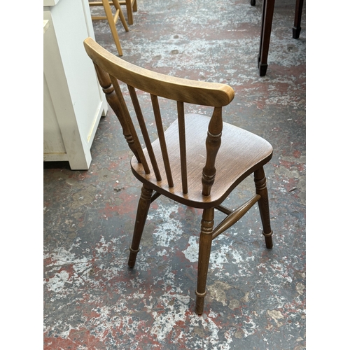 159 - A late 20th century oak and beech circular dining table - approx. 73cm high x 91cm diameter
