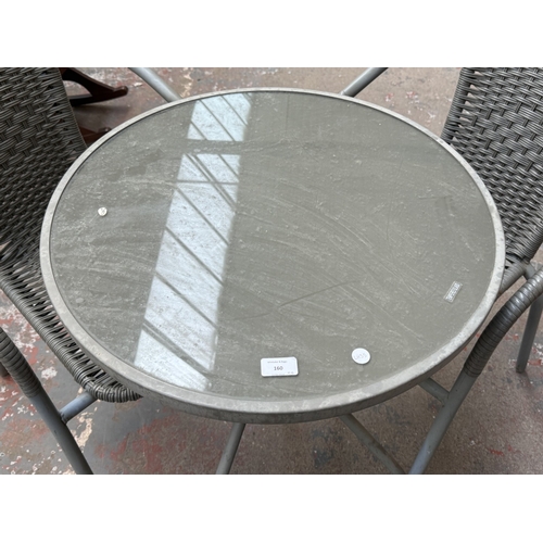 160 - A grey metal three-piece patio set comprising circular glass-top table and two plastic wicker effect... 