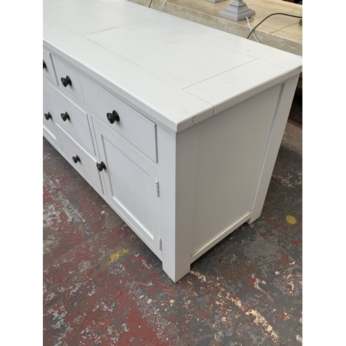 165 - A Halo white painted oak sideboard - approx. 77cm high x 150cm wide x 56cm deep