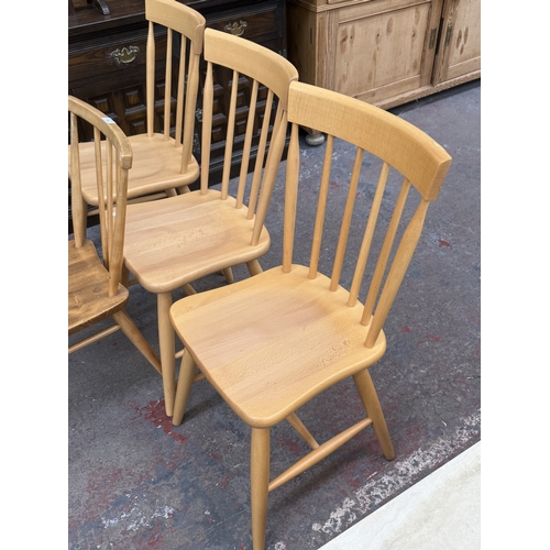 166 - Four spindle-back dining chairs, one Ercol model 391 blonde elm and beech, and three modern Ercol st... 