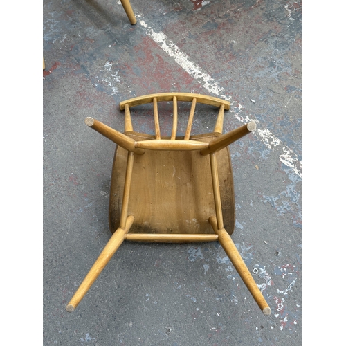 166 - Four spindle-back dining chairs, one Ercol model 391 blonde elm and beech, and three modern Ercol st... 