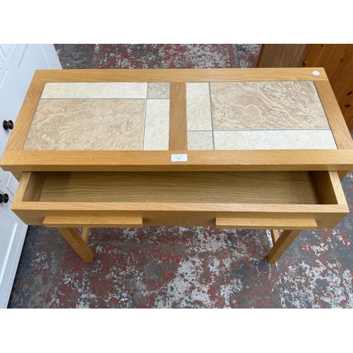 167 - A modern oak and tiled top single-drawer console table - approx. 75cm high x 85cm wide x 35cm deep