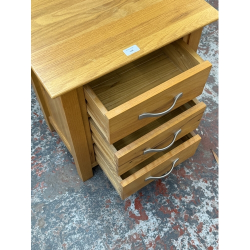 168 - A modern oak bedside chest of drawers - approx. 57cm high x 50cm wide x 35cm deep