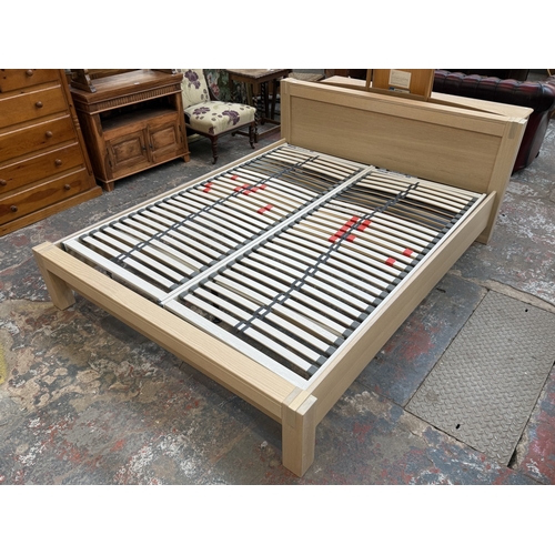 171 - A modern limed oak kingsize bedframe - approx. 80cm high x 172cm wide x 219cm deep