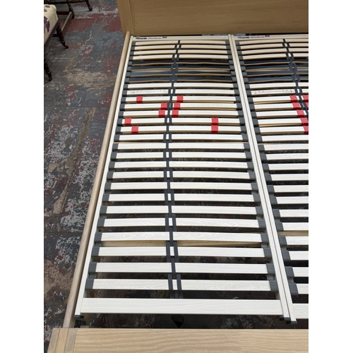 171 - A modern limed oak kingsize bedframe - approx. 80cm high x 172cm wide x 219cm deep