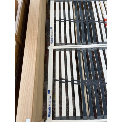 171 - A modern limed oak kingsize bedframe - approx. 80cm high x 172cm wide x 219cm deep