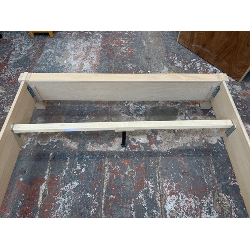 171 - A modern limed oak kingsize bedframe - approx. 80cm high x 172cm wide x 219cm deep