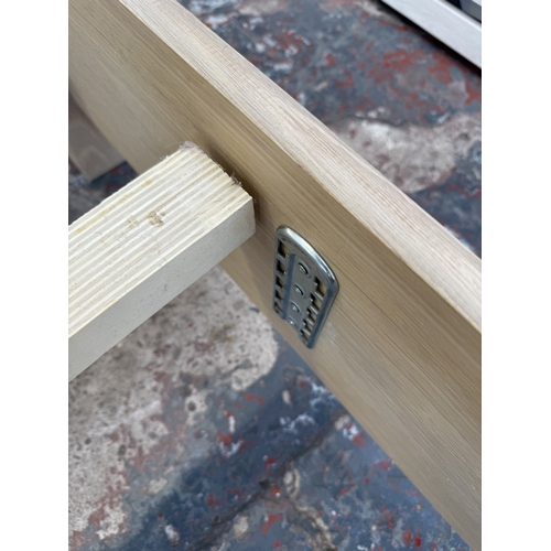 171 - A modern limed oak kingsize bedframe - approx. 80cm high x 172cm wide x 219cm deep