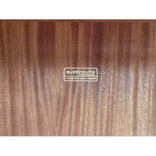 178 - A mid 20th century Austinsuite carved oak four piece bedroom suite comprising two double wardrobes, ... 