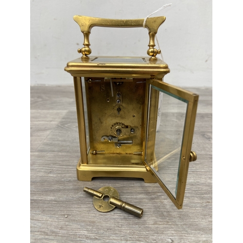 A French brass and bevelled glass cased keywind carriage clock with key ...