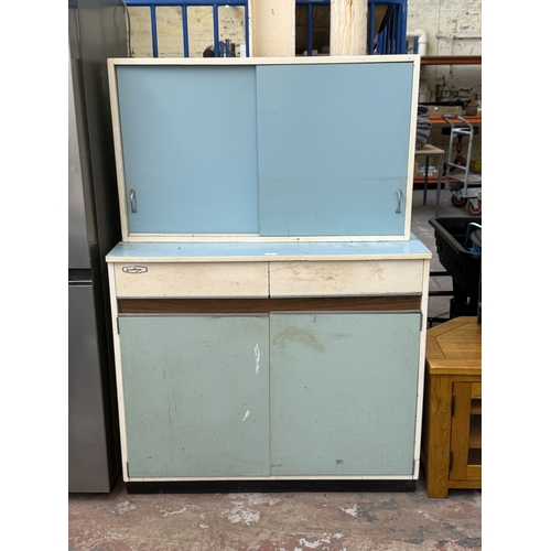 74 - A mid 20th century Eastham white painted and blue laminate kitchen cabinet - approx. 152cm high x 10... 