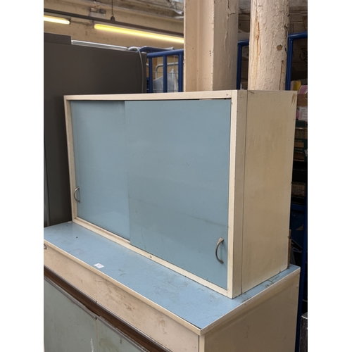 74 - A mid 20th century Eastham white painted and blue laminate kitchen cabinet - approx. 152cm high x 10... 