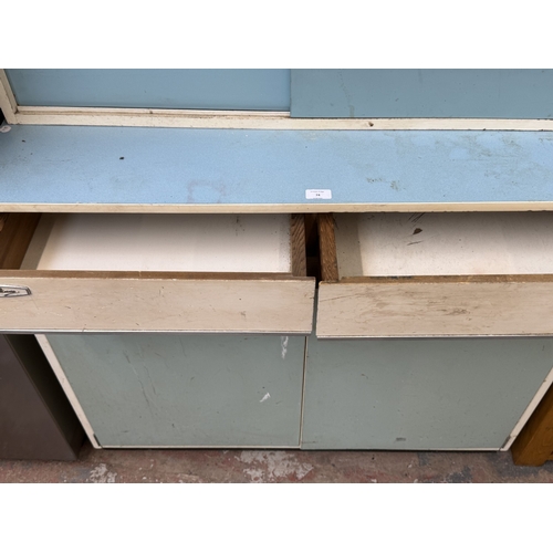 74 - A mid 20th century Eastham white painted and blue laminate kitchen cabinet - approx. 152cm high x 10... 