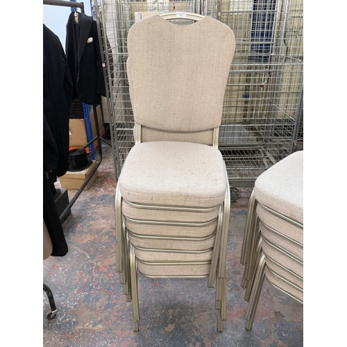 78 - Six silver painted metal and beige fabric upholstered stacking chairs