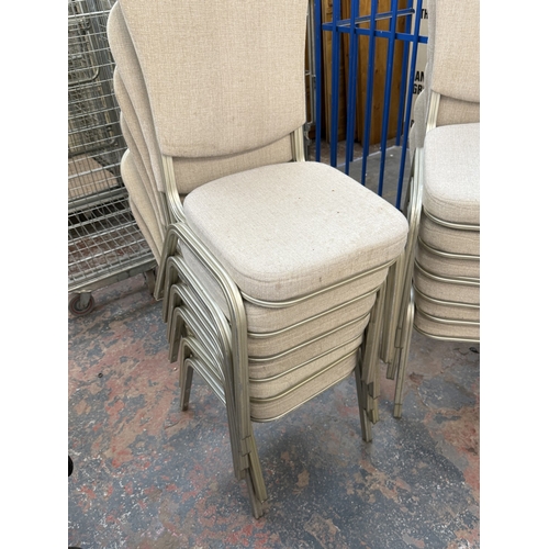 78 - Six silver painted metal and beige fabric upholstered stacking chairs