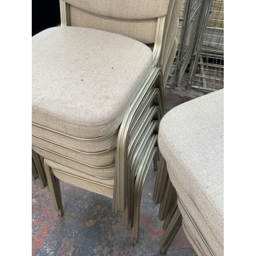 78 - Six silver painted metal and beige fabric upholstered stacking chairs