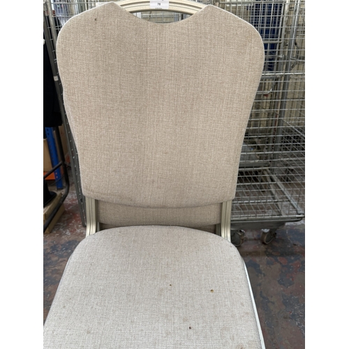 78 - Six silver painted metal and beige fabric upholstered stacking chairs