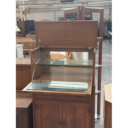 96 - A Jaycee carved oak linenfold cocktail cabinet - approx. 124cm high x 75cm wide x 43cm deep