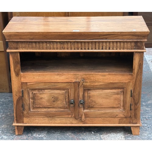 176 - A sheesham wood TV stand - approx. 76cm high x 91cm wide x 39cm deep