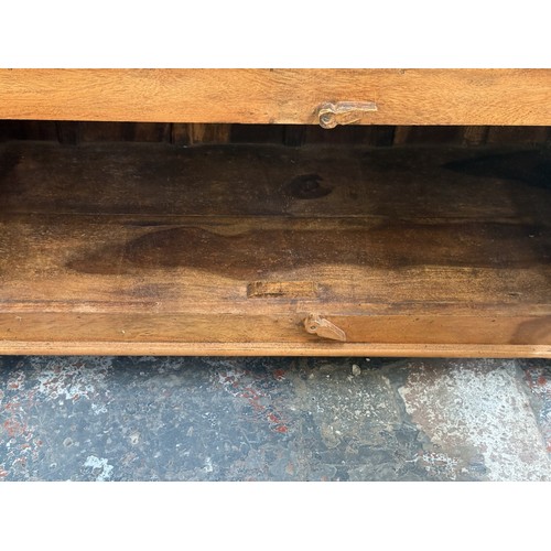 176 - A sheesham wood TV stand - approx. 76cm high x 91cm wide x 39cm deep