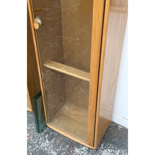 80 - An Ercol Windsor blonde elm and ash narrow display cabinet with six glass shelves - approx. 213cm hi... 