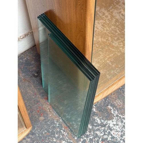 80 - An Ercol Windsor blonde elm and ash narrow display cabinet with six glass shelves - approx. 213cm hi... 