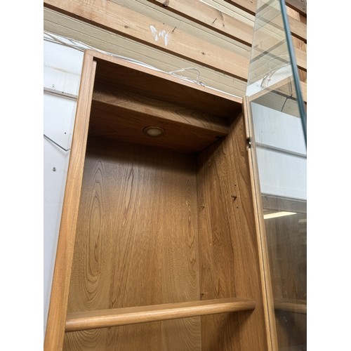 80 - An Ercol Windsor blonde elm and ash narrow display cabinet with six glass shelves - approx. 213cm hi... 